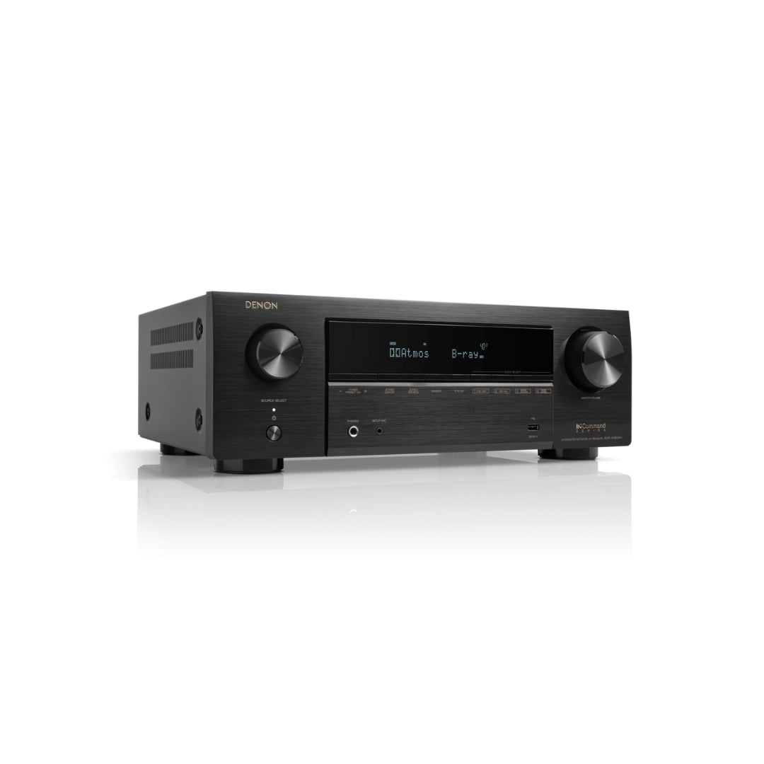 Black Denon audio receiver on a white background