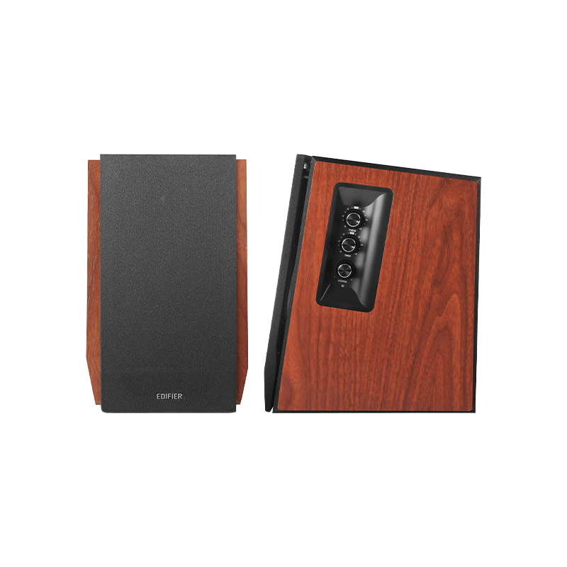 Pair of speakers with wooden finish and remote control on a white background