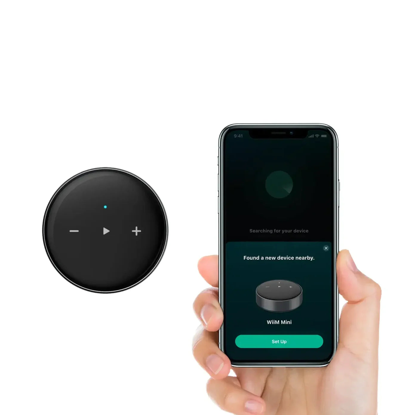 Round black electronic device with buttons on a white background